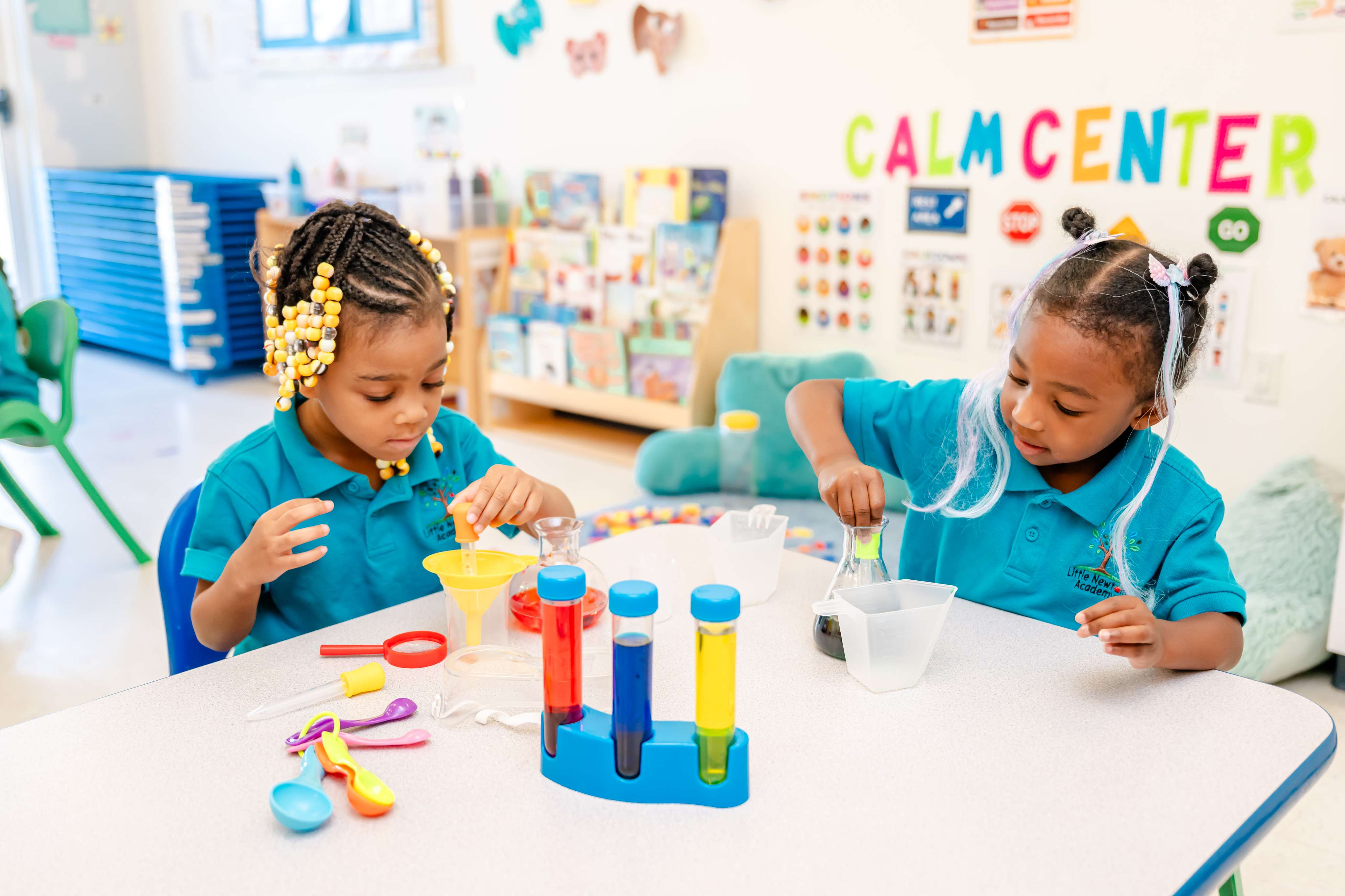 Pre-K children conducting a hands-on science experiment with test tubes